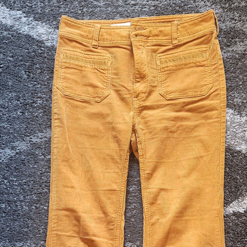 Burnt orange boot-cut Anthropologie corduroy pants